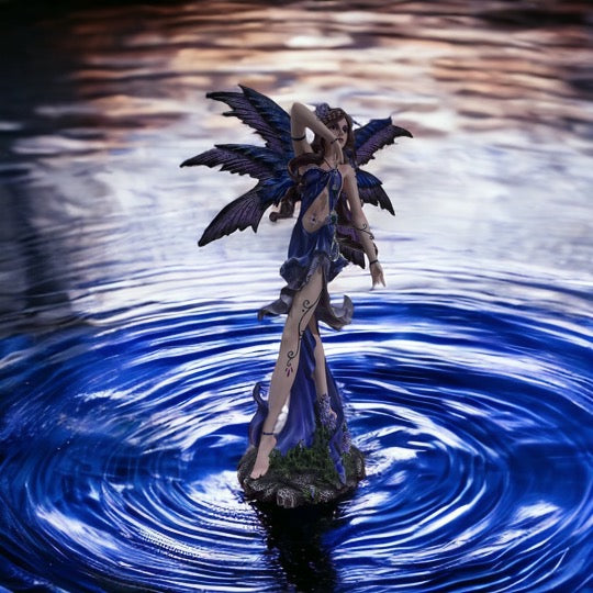 Blue and purple fairy with jewel